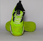 neon green Under Armour Curry Flow 10 basketball shoe featuring a black Warp upper and a white and green Flow midsole.