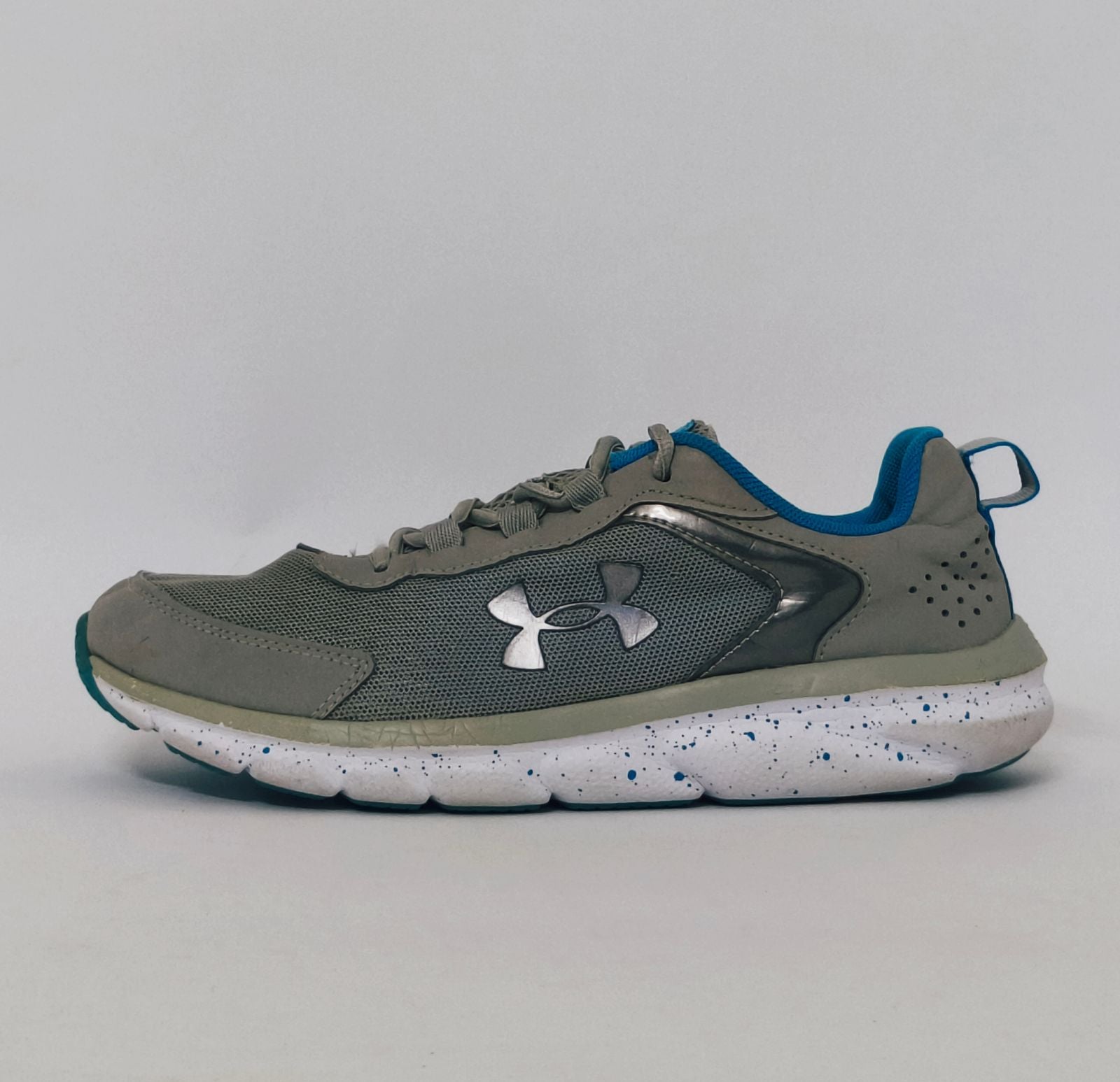 Under Armour training shoe with blue accents and a blue-speckled white midsole.