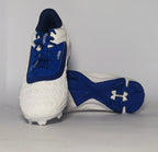 white and royal blue Under Armour cleat featuring a textured forefoot and a durable molded cleat outsole.