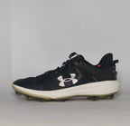 black Under Armour Harper baseball cleat featuring a white logo, white midsole, and a specialized cleated outsole for field traction.