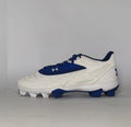 white and royal blue Under Armour cleat featuring a textured forefoot and a durable molded cleat outsole.