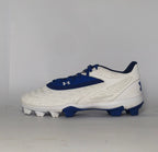 white and royal blue Under Armour cleat featuring a textured forefoot and a durable molded cleat outsole.