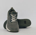 Black athletic sneakers with breathable knit upper and lightweight cushioned sole in used condition size US 7.5