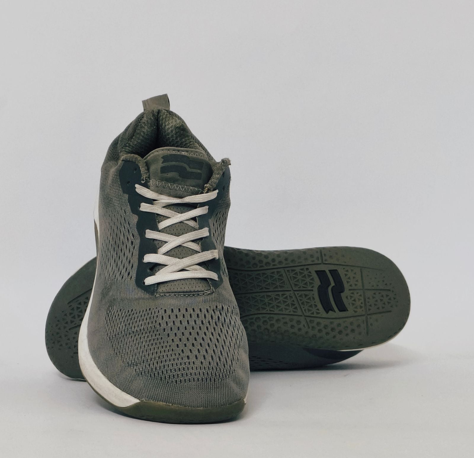 Black athletic sneakers with breathable knit upper and lightweight cushioned sole in used condition size US 7.5