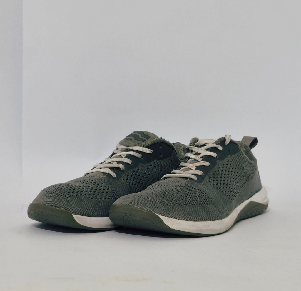 Black athletic sneakers with breathable knit upper and lightweight cushioned sole in used condition size US 7.5